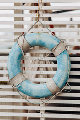 Old blue lifeline on the basis of rescuers. Lifeline to the sea.