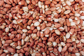 Closeup image of salted peanuts as a food background