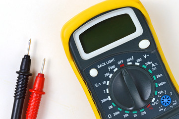 tester with probes on a white background. view from above.
