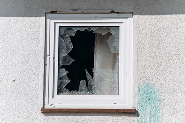 Broken Windows in the house. Shards of glass remained in the window.