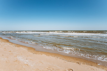 Soft wave of the sea on the sandy beach. Coastline of the sea