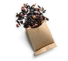 Black tea with natural aromatic additives. Top view on white background