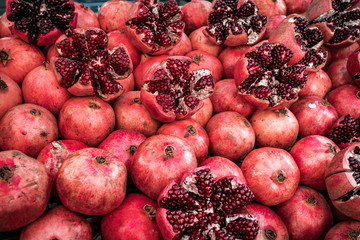 Many pomegranate cut in half, pomegranate background