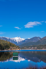 Fototapeta na wymiar View at Mountain Lake with Blue Sky in British Columbia, Canada.