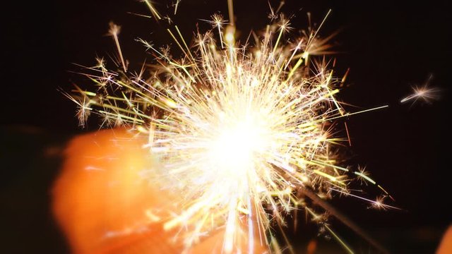Super Slow Mo. Lighting up sparkler using lighter in night. Best sources of flame to light an amazing bengal fire are butane lighters and propane torches. Close up