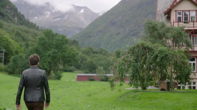 Man walking on the mountaing faling by a shoot