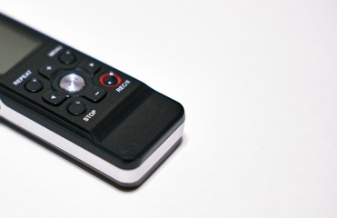 The speaker on a plain background. Sound recording equipment.