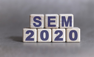 Sem 2020 concept. Wooden cubes on a black keyboard
