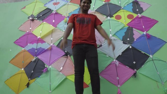 Young man with Patang(kite) for Makar Sankranti festival of India. Makar Sankranti is kite festival of India. It is also known as uttarayan