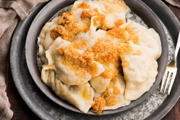Boiled pierogi (Polish dumplings) stuffed with cabbage and mushrooms