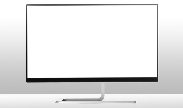 Modern monitor on white table and light background.