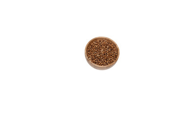 spice dried coriander in a wooden Cup isolated on wite background