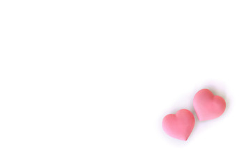 Decoration of Valentine Day. Beautiful pink coral hearts on a white background with space for text. Top view, flat lay