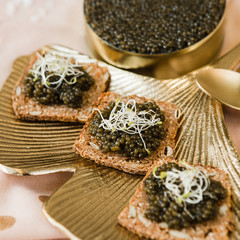 chic expensive red caviar, pike caviar and black caviar for a snack