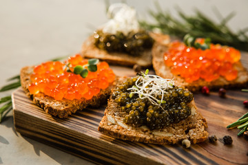 chic expensive red caviar, pike caviar and black caviar for a snack