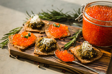 chic expensive red caviar, pike caviar and black caviar for a snack