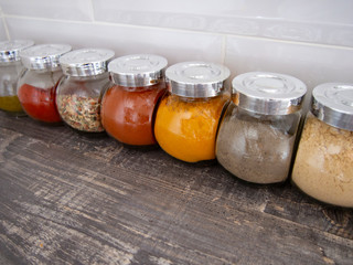 Bright aromatic spices in glass jars