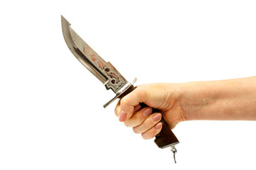 Hunting knife in a female hand isolated on a white background. Dagger in a female hand on a white background.