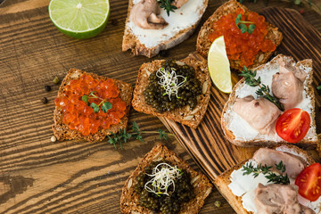 chic expensive red caviar, pike caviar and black caviar for a snack