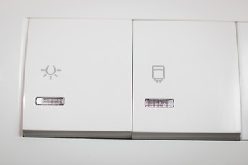 White double switch, controls light and water heater, close up shot