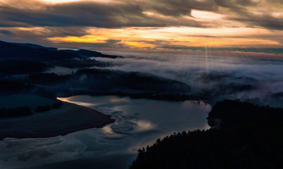 Sunrise in winter at the fog sea over Lake Eixendorf