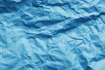 Crumpled blue paper as background