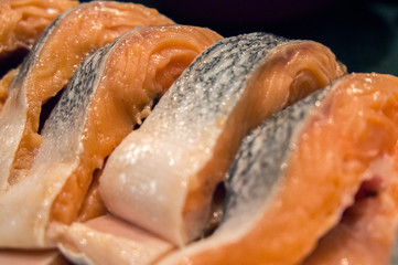 Fresh salmon fish sliced slices of food fillet closeup.