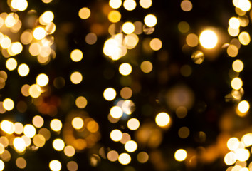 Bokeh lights background. Abstract gold background with soft blur bokeh light effect