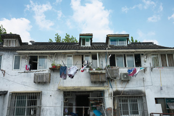 Suzhou,China-September 17, 2019: Houses along a canal running near Humble Administrator's Garden or Zhuozheng yuan in Suzhou, China