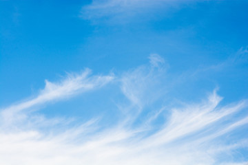 Naklejka na ściany i meble Cirrus clouds over a blue sky background