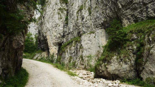 walking through the natural gorges Zarnesti Canyon in Romanian Carpathians