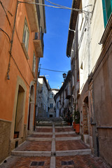 Fototapeta na wymiar Campobasso, Italy, 24/12/2019. A narrow street between the old buildings of a medieval town