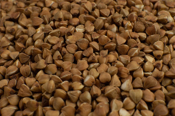 Background and texture of Buckwheat. Roasted buckwheat. Garnish. Ingredient. Dietary product.