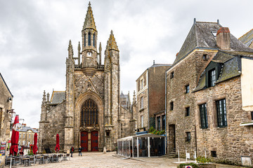 Street view in medieval Guerande town, Pilori square with Chapel Notre-Dame-La-Blanche de Guerande at background. Loire-Atlantique region in Western France.