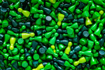 Playful Concepts: Pattern made from game figurines in several shades of green