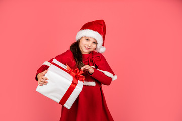 Little secret. merry christmas. xmas joy mood. small santa kid pink background. little girl present box. winter holiday shopping. time for presents. gift brings joy and happiness. happy new year