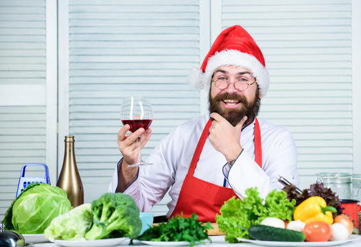 Perfect wine. Chef man in hat. Secret taste recipe. Dieting and organic food, vitamin. Vegetarian. Mature chef with beard. Healthy food cooking. Bearded man cook in kitchen, culinary. Christmas