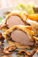 pork filet in puff pastry with croquettes