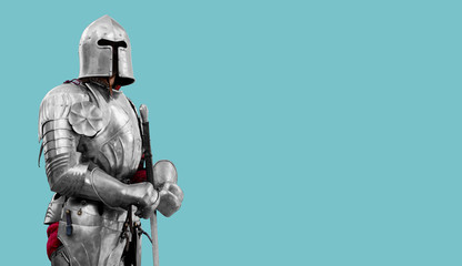 Knight in shiny metal armor. Reliable security and insurance. Copy space. - obrazy, fototapety, plakaty
