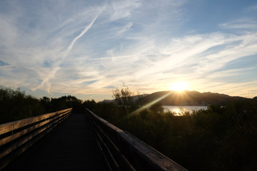 Sunset by the beach in Troia Portugal with wooden walkway