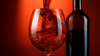 Detail of pouring red wine into glass