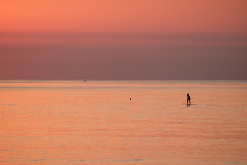 Fototapeta premium silhouette of a standup paddler in Barcelona Spain, Catalonia