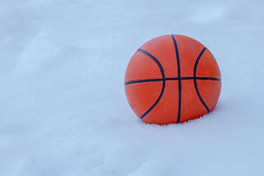 Basket ball on snow during winter