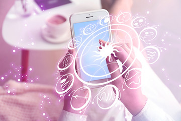 Young woman with mobile phone reading astrological forecast at home, closeup