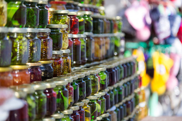 Jars of jam in a row.