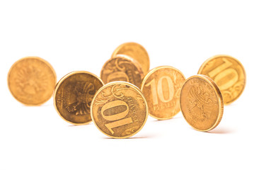 Ten rubles in several coins on a white background