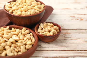 Bowls with cashew nuts on table
