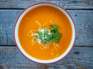 Tomato soup with grated cheese and dill
