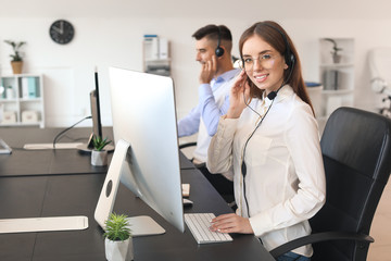 Female technical support agent working in office