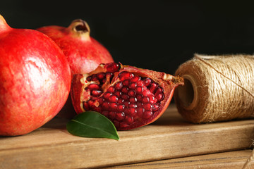 Tasty pomegranate on wooden boards